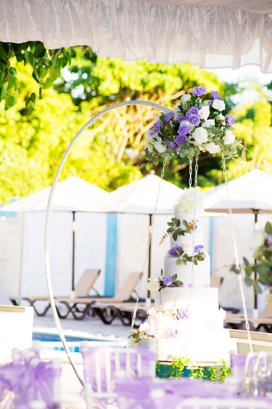 Elegant wedding reception setting at an Orange County venue with custom cake centerpiece