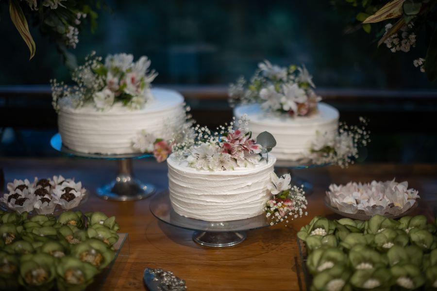 Soft buttercream wedding cake with fresh flowers